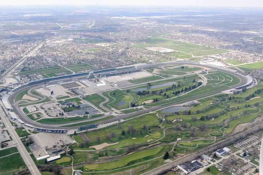 Aerial view of Indianapolis 500, an automobile race held annually at Indianapolis Motor Speedway in Speedway, Indiana through clouds. View from airplane. File photo: Jeremy Christensen, Shutter Stock, licensed.
